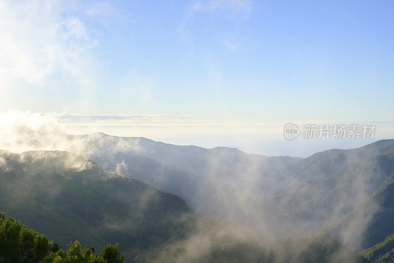 Clouds over the mountains near Rabaçal on Madeira island during sunset